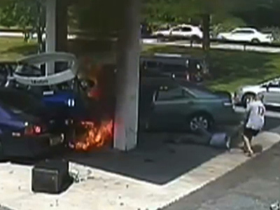 Raw: Officer Saves Man From Gas Station Blast
