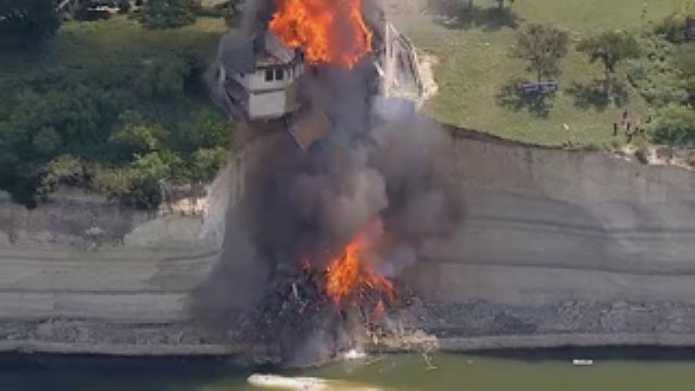 Raw Video Clip - House Teetering On Cliff Gets Burned Down