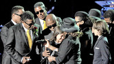 [Jackson family members appear on stage at the public memorial service Tuesday in Los Angeles.]