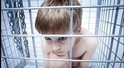 A photograph of an unnamed boy in a cage features in Sean O'Carroll's exhibition about Ritalin.